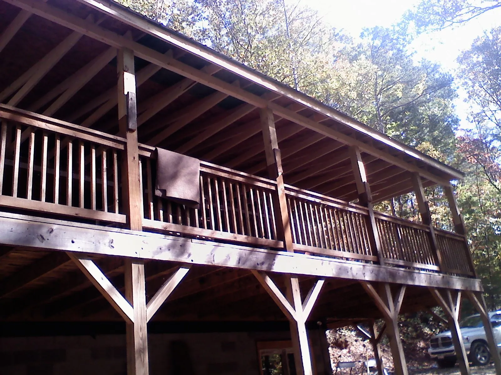 Timber framing under a new elevated porch and deck — Roof Leak Repair in Skaneateles by Roofing Brothers